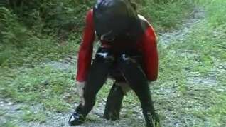 Online film Butt toying in latex during a hike in the nature