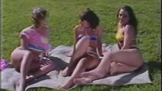 Online film Retro lesbian threesome in a public garden in the sun